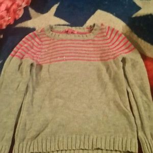 A grey justice long sleeve sweater